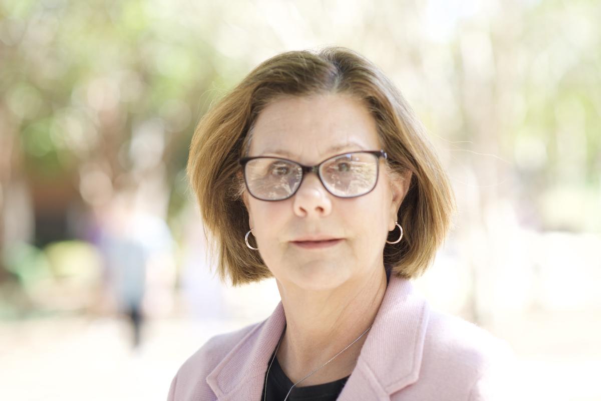 Dr. Missy Hopper standing outside of Allen Hall.